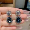 Pendientes de botón de diseño nicho, versátiles, femeninos, con forma de gota de agua, flor de cristal pesado, de lujo ligero de alta gama, para mujer