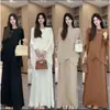 Elegante atuendo de otoño para mujer: un conjunto de dos piezas nuevo, chic y de corte holgado que presenta un top de punto con manga murciélago y una falda midi plisada