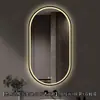 Espejo de baño inteligente ovalado en stock con lijado exterior e iluminación LED translúcida, adecuado para montaje en pared de baño y proyectos hoteleros, con opciones de personalización.