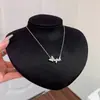 Collar con colgante de mariposa microincrustado de circón, dulce y elegante, estilo coreano, para mujer, versátil para ir al trabajo, cadena para la clavícula de acero de titanio, venta al por mayor