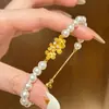 Perlas Florales Abrazan la Luna Pulsera de Perlas de Osmanthus Dorado Francés Retro Lujo Ligero Elegante Temperamento Artístico Pulsera de Gama Alta