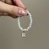 Mini Labubu Cuarta Generación Caja Sorpresa Ropa de Muñeca Collar Colgante Labubu 26 Letras Collar de Perlas Accesorios de Joyería