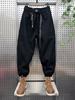 Pantalones casuales nuevos de otoño e invierno para hombre, pantalones harén de pierna ancha holgados de talla grande, monos de moda nacional con tobillos atados.