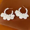 Pendientes de borla de circonita con pétalos de cuentas de aguja de plata y perlas, accesorio versátil para vacaciones, pendientes de lujo ligero de alta gama