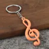 Nuevo llavero de metal con nota musical personalizada estilo dopamina, colgante pequeño promocional, colgante de cadena para llavero con símbolo musical