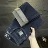 Pantalones Vaqueros de Alta Gama Bordados para Primavera y Otoño Hombres 2026 Nueva Marca de Tendencia Pierna Recta Ajustada Pantalones Largos Otoño Elásticos Casuales
