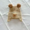 Gorro de bebé otoño e invierno niños oso gorro de lana bola de pelo de bebé gorro de punto cálido para hombres y mujeres protección para las orejas moda