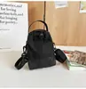 Bolso cruzado de marca de moda transfronterizo para hombre y mujer, mochila pequeña tipo cubo con cordón para deportes al aire libre, de color a juego, estilo coreano, de un solo hombro