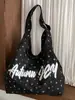 Bolsa de mano tipo tote de estilo coreano, minimalista, con estampado de letras y lunares para mujer, nueva colección 2026, gran capacidad, bolso de hombro, casual y adecuado para ir al trabajo