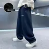 Pantalones de Felpa Sueltos con Dibujos Animados para Niños Otoño e Invierno 2025 Nuevo Estilo Ropa de Invierno para Niños Grandes Pantalones Rectos Integrados de Felpa Venta al por Mayor Modernos