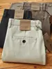 [Gama alta] Nuevos pantalones largos de peso pesado de algodón peinado retro lavados a la arena 2026, pantalones casuales de pierna recta para hombre, adecuados para otoño e invierno