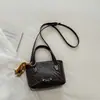 Bolso de mano de moda para el trabajo estilo coreano 2026 verano nuevo bolso cruzado de moda color liso simple nicho bolso de hombro