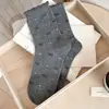 Calcetines de cachorro de dibujos animados para mujer, otoño e invierno, lindo lazo, estilo universitario, calcetines apilables sin costuras, calcetines grises de media pantorrilla