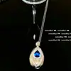 Huguang Sombra de Agua Azul Mar Profundo Denier Gema Aretes Campana de Viento Diseñador Chapado Oro de 18K Gota Zircón Collar Pavo Real