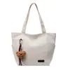 A Bolsa Sacola Casual e Simples Popular Deste Ano para Sala de Aula de Estudantes é uma Bolsa de Ombro Leve da Moda de Grande Capacidade Estilo Executivo para Mulheres