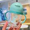 Nuevo vaso para beber para bebé, vaso de plástico con pajita para niños con asa, bola de gravedad, vaso de agua de dinosaurio de dibujos animados para bebé