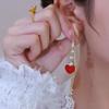 Líneas de oreja de borla de amor rojo 2023 nuevo moderno de alta gama lujo ligero largo cara redonda elegante pendientes elegantes para mujeres