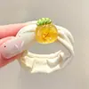 Coloridos coleteros de nuevo estilo 2026, versátiles y dulces, con accesorios de M&M's, anillos de toalla, diseños de dibujos animados y un estilo fresco y lindo, perfectos para accesorios para el cabello de niños