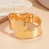 Pulsera Abierta Geométrica Asimétrica Ovalada Metálica Europea y Americana Elegante Exagerada de Nicho Joyería de Mano de Alta Gama para Mujeres