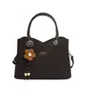 Bolso de mano de gran capacidad para mujer, nuevo modelo de otoño 2026, bolso tipo cubo de alta gama vintage versátil para el hombro y cruzado para el día a día