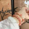 Promocional de Transmisión en Vivo Pulsera de Peluche Flor de Durazno Rosa Fabricante Venta al por Mayor Natural Seda Dorada Jade Flor de Durazno Relleno Pulsera de Cuentas Redondas