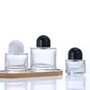 Botella de perfume cilíndrica de vidrio transparente botella secundaria de perfume botella con pulverizador de presión de alta gama portátil muestra cosmética botella vacía