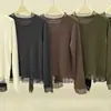 Top de punto sencillo de color liso con manga larga, ribeteado con encaje de malla y un dobladillo delicado, perfecto para principios de otoño, una capa interior ajustada para mujer