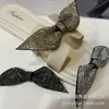 Flor de zapato con pedrería al por mayor Pasador para ropa y cabello Accesorios de bricolaje Accesorios Pedrería Super Brillante Estéreo Lazo
