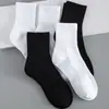Calcetines calcetines de algodón negros y blancos para hombre banda alta deportiva calcetines de media caña para hombre calcetines cortos cintura alta calcetines de baloncesto calcetines para mujer fabricantes