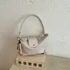 Bolso tejido con patrón transfronterizo para mujer, nuevo bolso tipo cubo de gran capacidad, bolso de hombro versátil y moderno para llevar debajo del brazo