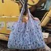 Bolsas de compra ecológicas para supermercado de gran capacidad al por mayor en stock plegables portátiles con fuerte almacenamiento bolsa para la compra de Japón y Corea del Sur