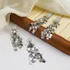 Atmósfera de Otoño e Invierno Estrella Plateada Borla Clip para Oreja Sin Perforar para Mujer Diseño de Nicho Pendientes Elegantes Versátiles de Alta Gama