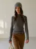 Tejido de hilo de núcleo Suéter de punto trenzado ajustado de cuello semi-alto simple adelgazante versátil jersey top de capa base