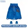 Ropa de hombre personalizada y moderna: Shorts de estilo americano de calle rasgados con borde crudo bordados, shorts de cintura alta holgados con tachuelas