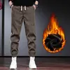 Calças Masculinas Outono e Inverno Calças de Moletom Casuais Masculinas com Forro de Fleece Calças de Veludo Grossas Modelo Harem Relaxado