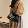 Bolso de Hombro Retro de Gran Capacidad Transfronterizo de Moda para Mujer 2026 Nueva Moda Cadena Simple de un Solo Hombro Cruzado
