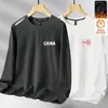 Camiseta de manga larga para hombre para otoño e invierno, marca de moda, corte holgado, forrada de forro polar, engrosada, camiseta básica casual, sudadera de cuello redondo para estudiantes jóvenes