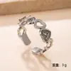 Nuevo anillo de botón hueco europeo y americano, no se decolora, simple y elegante, anillo de acero inoxidable con forma de corazón geométrico prensado en aceite para joyería