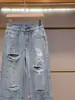 Shenzhen Nanyou ropa de mujer de alta gama verano nuevo moda diseño elegante nicho pedrería rotos jeans rectos