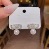 Pendientes de lazo dulces y elegantes de estilo coreano para mujer, modernos y versátiles, adecuados para ir al trabajo, con colgantes de perlas, el mismo estilo que los pendientes populares de influencers en línea