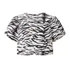 2025 Verano Nuevo Moda Callejera Femenina Europea y Americana Conjunto de Top con Estampado Animal + Falda Corta 2725 Poliéster