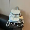 Mochila retro de lunares casual transfronteriza, modelo nuevo 2026, mochila versátil para el trabajo y los viajes, bolso de mano y bolso de hombro de moda