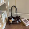 Bolso tote de nicho estilo coreano con decoración de cinturón para mujer, nuevo bolso de hombro simple para el otoño de 2026, bolso de axila