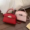 Bolso de Mano Pequeño Elegante de Gama Alta para Mujer 2026 Nuevo Bolso Cruzado Versátil Bolso Tote Pequeño Kelly Super Popular de Moda