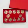 Oro Puro 999 Juego Completo de Doce Colores de Oro del Zodiaco Pegatinas para Teléfono Móvil para Exquisitos Regalos Navideños Shuibeike Mayoreo