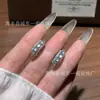 Venta al por mayor del fabricante Pinzas para orejas de Jade Azul Natural Xiaohongshu con incrustaciones de Plata S935, Nuevo diseño de estilo chino de lujo ligero