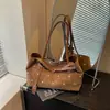 Hebilla de cinturón de lunares de moda europea y americana transfronteriza estilo coreano bolso de mano simple para el día a día bolso tote de hombro principios de otoño 2026