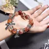 Diseño Original Flor Roja de Goma Pulsera de Cristal Caja Mágica DIY Cuentas Hechas a Mano Pulsera de Cristal Natural Joyería Transfronteriza