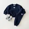 Otoño 2026 Estilo Coreano Ins Bordado Corazón Pequeño Cuello Redondo Sudadera de Rizo Conjunto Dos Piezas Nueva Sudadera y Pantalones de Chándal
