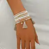 Pulsera apilada de cuentas de semillas con colgante de borla de cuentas bohemia más vendida transfronteriza con un diseño geométrico de alta gama